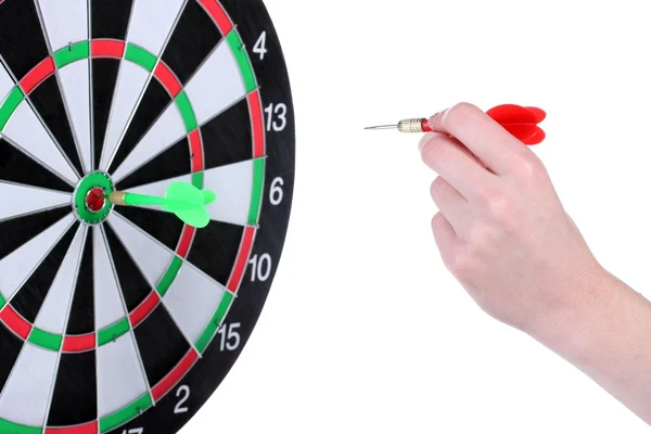 Dart board and hand with dart isolated on white — Stock Photo, Image