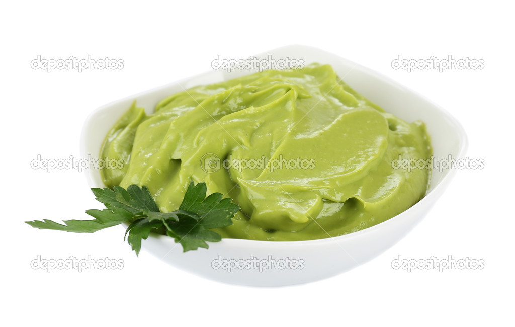 Fresh guacamole in bowl isolated on white 