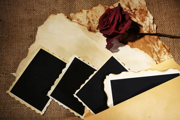 Composition with blank old photos, paper, letters on sackcloth background — Stock Photo, Image