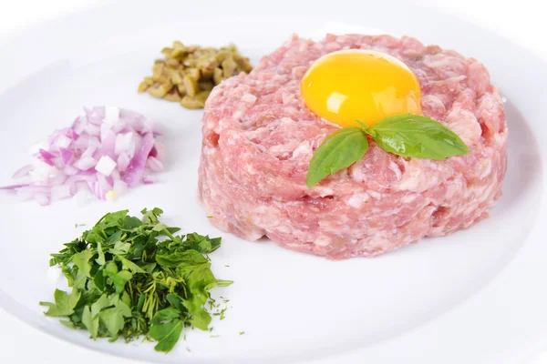 Delicious steak tartare with yolk on plate close-up — Stock Photo, Image