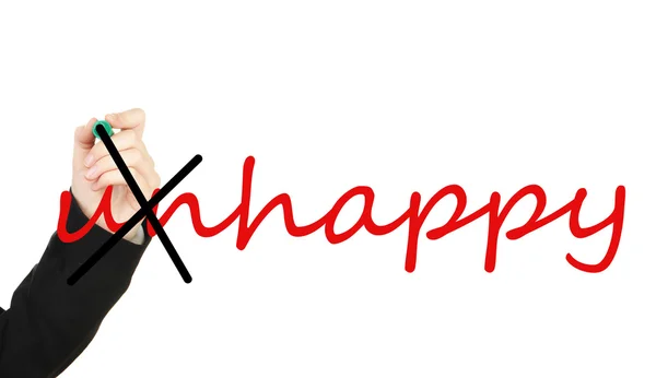 Hand verwandelt Wort unglücklich in glücklich — Stockfoto