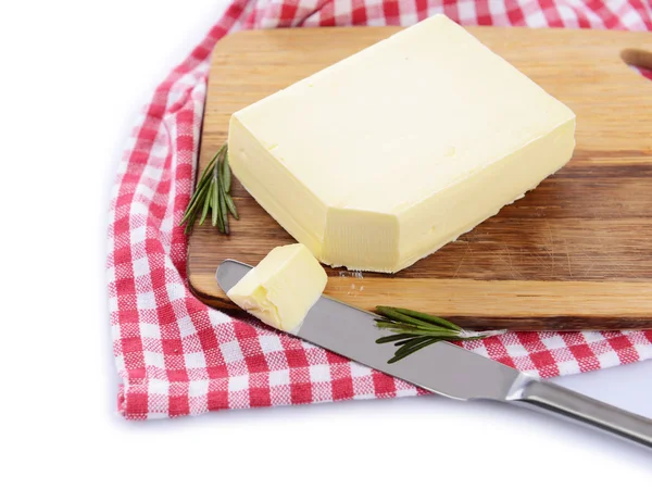 Sabrosa mantequilla en tabla de cortar de madera, aislada en blanco —  Fotos de Stock