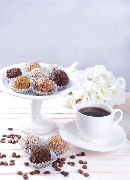 Set of chocolate candies on table on light background — Stock Photo, Image