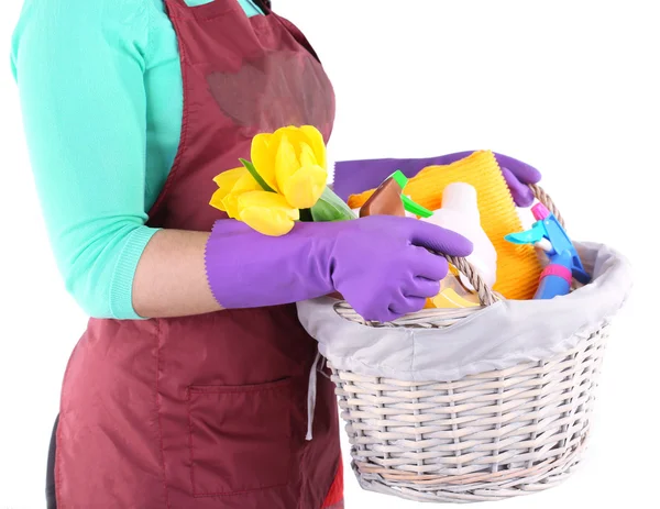 Housewife holding basket with cleaning equipment. Conceptual photo of spring cleaning. Isolated on white — Stock Photo, Image