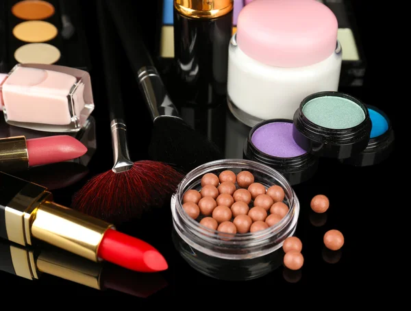 Professional make-up tools on black background