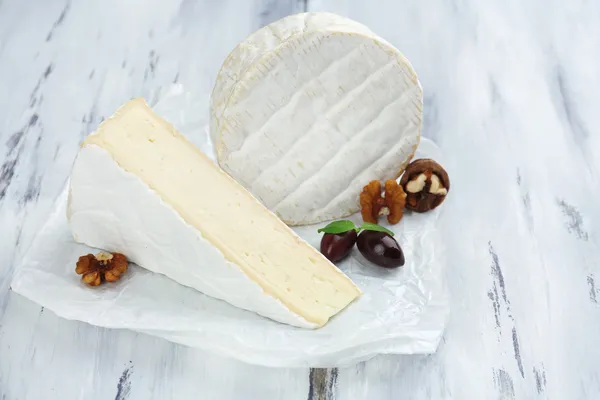 Tasty Italian cheese on wooden table — Stock Photo, Image