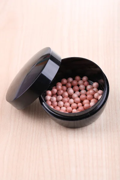 Powder balls on wooden background — Stock Photo, Image