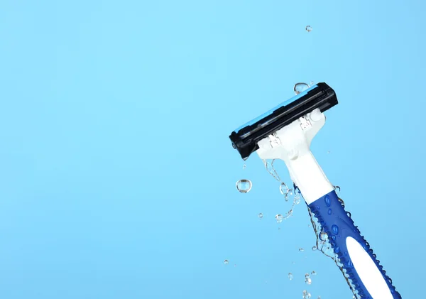 Men shaver on light blue background — Stock Photo, Image