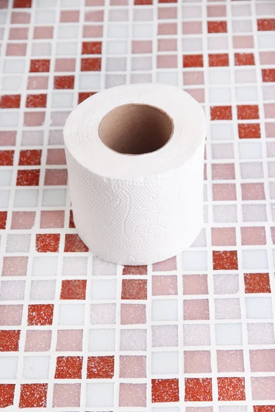 Color toilet paper roll on bright background — Stock Photo, Image