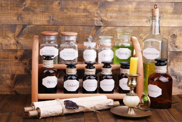 Historic old pharmacy bottles with label   on wooden background — Stock Photo, Image