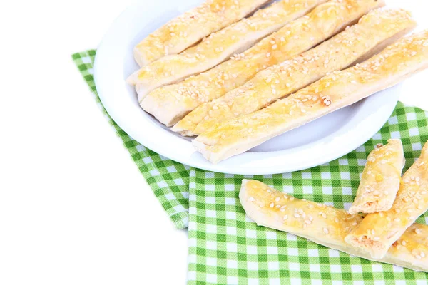 Palitos de pão saborosos na placa isolada em branco — Fotografia de Stock