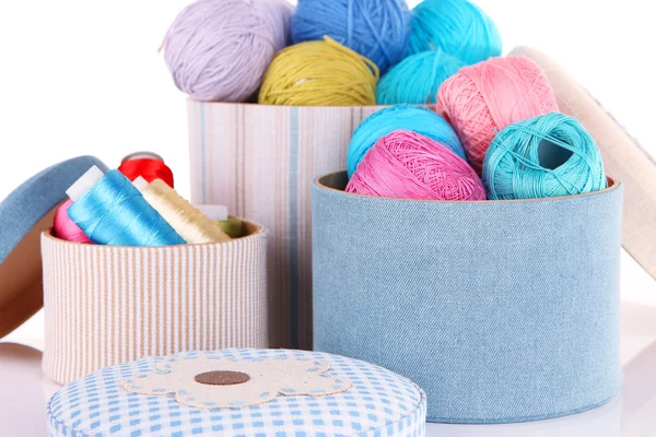Decorative boxes with colorful skeins of thread close up — Stock Photo, Image