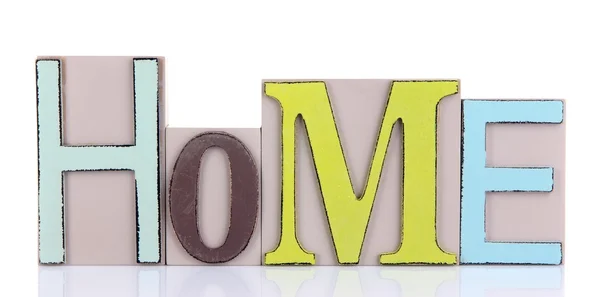 Letras decorativas formando palavra HOME isolado em branco — Fotografia de Stock