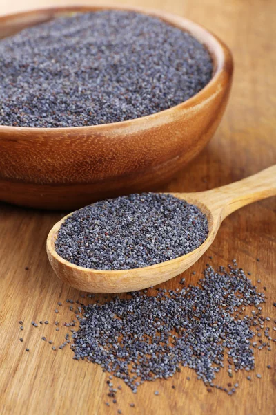 Poppy seeds on table close-up — Stock Photo, Image