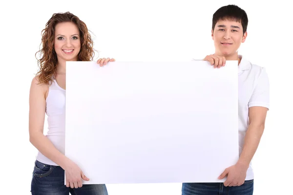 Dois belos jovens segurando cartaz em branco isolado em branco — Fotografia de Stock