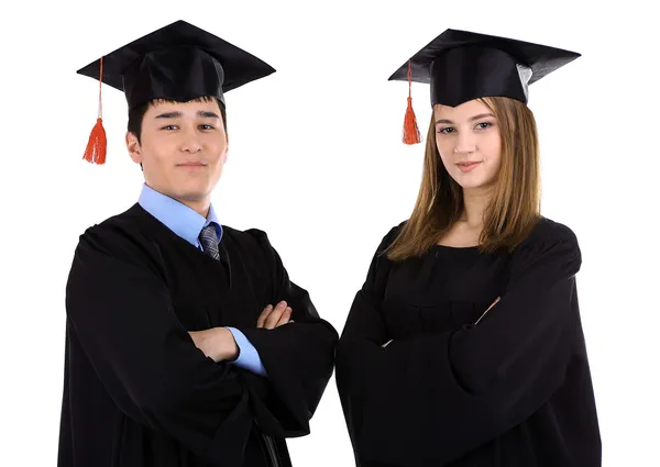 Due felici studenti laureati isolati su bianco — Foto Stock