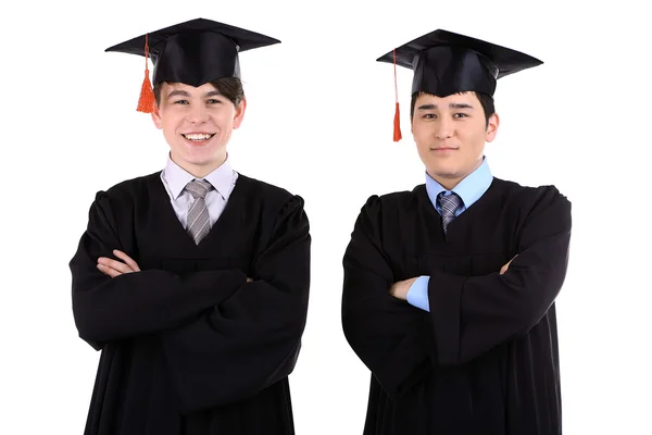 Dois estudantes graduados felizes isolados em branco — Fotografia de Stock