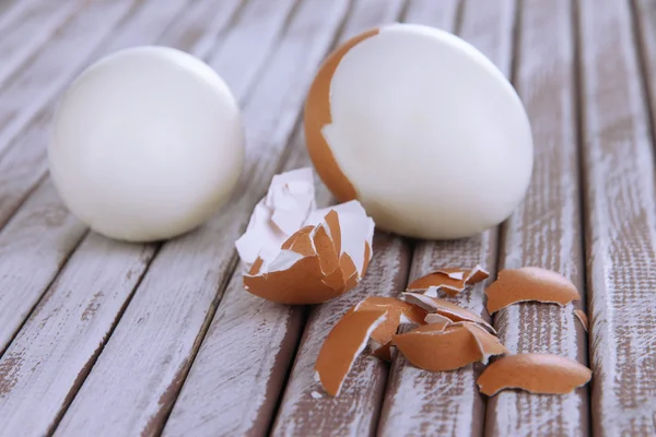 Peeled boiled egg on wooden background — Stock Photo, Image