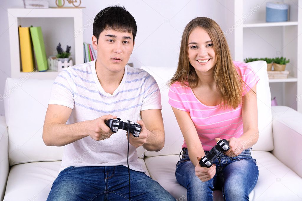 girl and boy playing video games