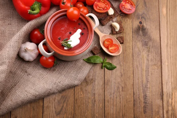 Tasty tomato soup and vegetables on wooden table — Stock Image Tasty tomato soup and vegetables on wooden table Royalty Free Stock Photos