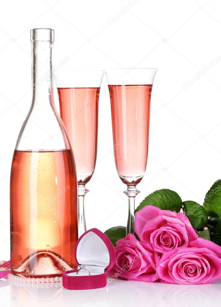 Composition with pink sparkle wine in glasses, bottle and pink roses isolated on white — Stock