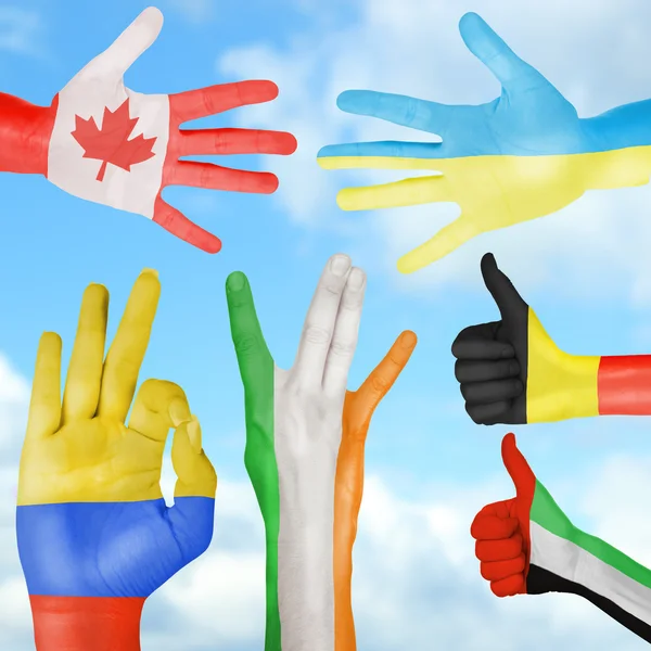 Flag of different countries painted on hand — Stock Photo, Image