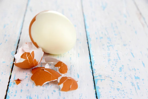 Peeled boiled egg on wooden background — Stock Photo, Image