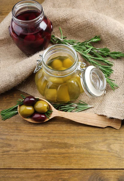 Tasty olives on wooden table — Stock Photo, Image