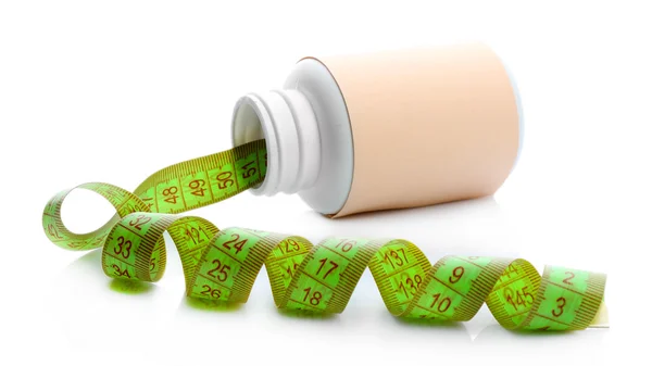 Measuring tape and pills, isolated on white. Dieting concept — Stock Photo, Image