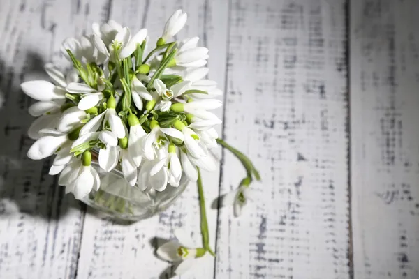 Bouquet of beautiful snowdrops on wooden background — Stock Photo, Image