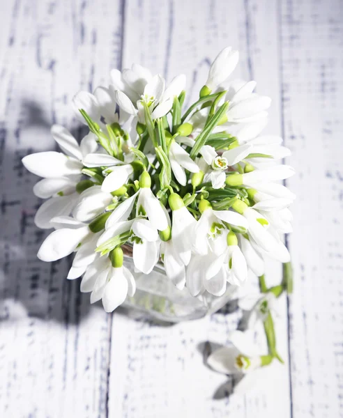 Bouquet of beautiful snowdrops on wooden background — Stock Photo, Image