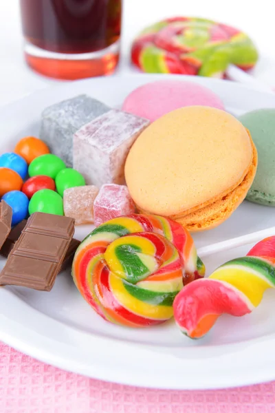 Different sweets on plate on table close-up — Stock Photo, Image