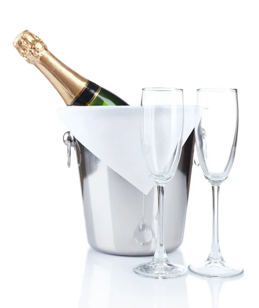 Bottle of champagne in pail and empty glasses, isolated on white — Stock Photo, Image