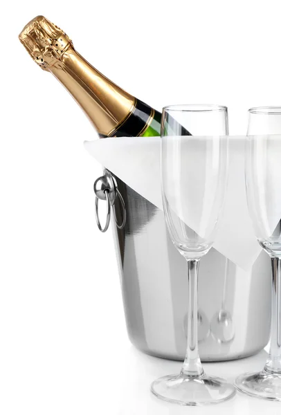 Bottle of champagne in pail and empty glasses, isolated on white — Stock Photo, Image