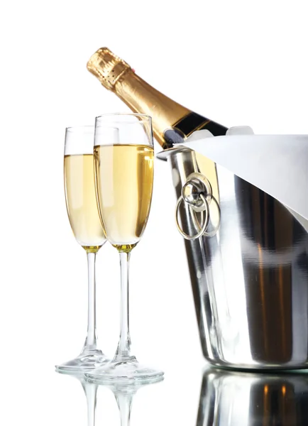 Glasses of champagne and bottle in pail, isolated on white — Stock Photo, Image