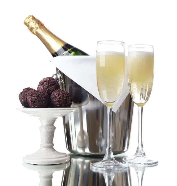 Glasses of champagne and bottle in pail on light background — Stock Photo, Image