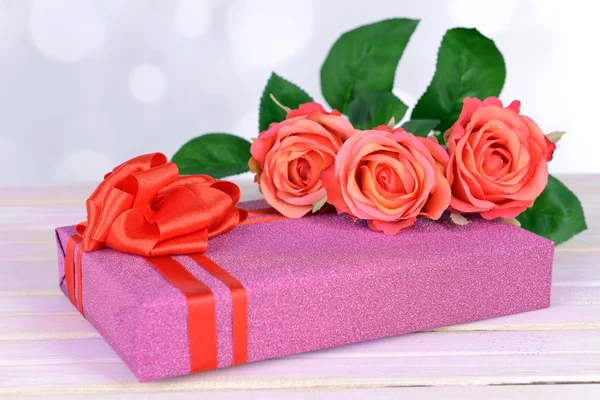 Gift box on table on light background — Stock Photo, Image