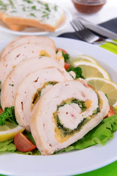 Delicious chicken roll on plate on table close-up — Stock Photo, Image