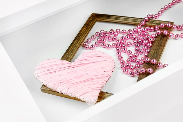 Gift box and beads in open desk drawer close up — Stock Photo, Image