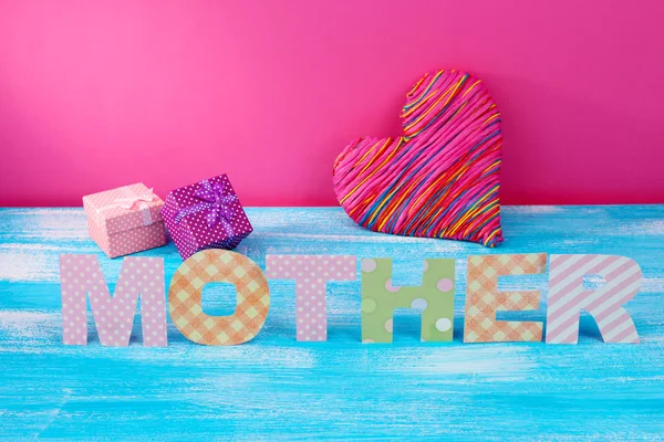 Mother- lettering of handmade paper letters on pink background — Stock Photo, Image