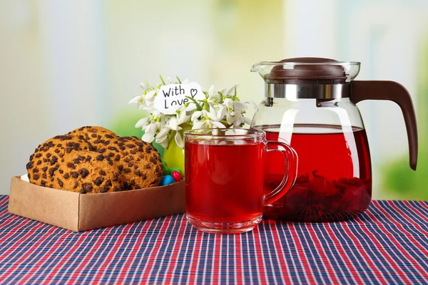 Tasty herbal tea and cookies on table — Stock Photo, Image