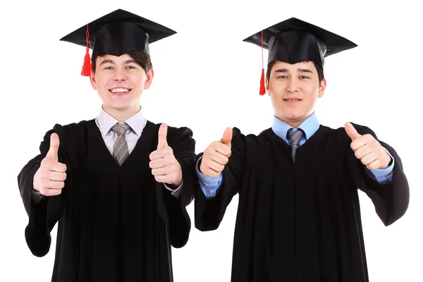 Dois estudantes graduados felizes isolados em branco — Fotografia de Stock