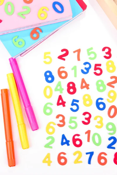 Colorful numbers, abacus, books and markers, isolated on white — Stock Photo, Image