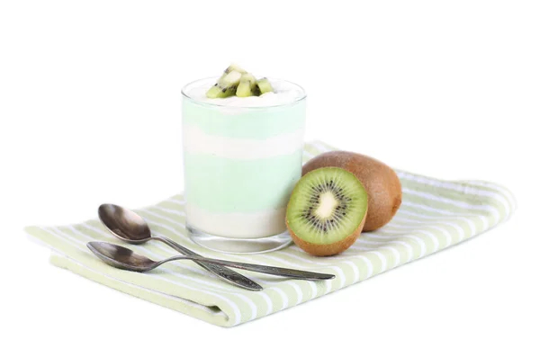 Delicioso yogur con sabor a fruta en vidrio sobre servilleta, aislado en blanco —  Fotos de Stock