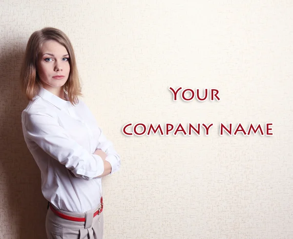 Portrait of businesswoman near wall — Stock Photo, Image