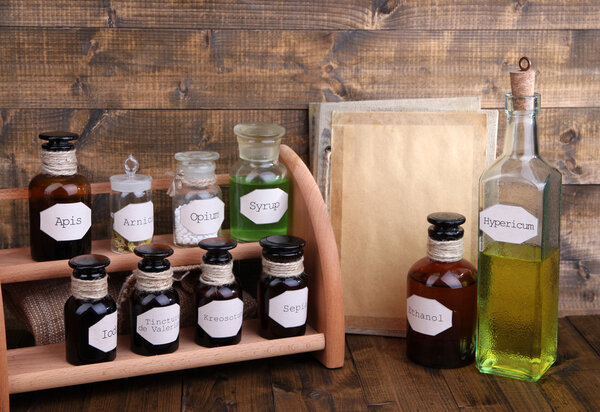 Historic old pharmacy bottles with label   on wooden background