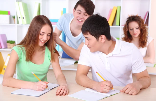 Group of young students sitting in class — Stock Photo, Image