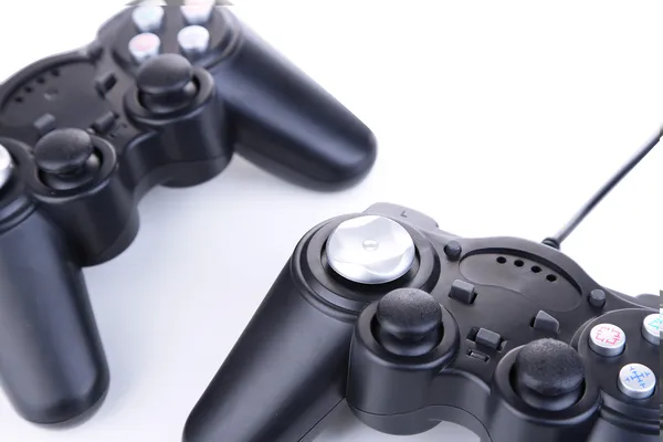 Schwarze Spielcontroller isoliert auf weiß — Stockfoto