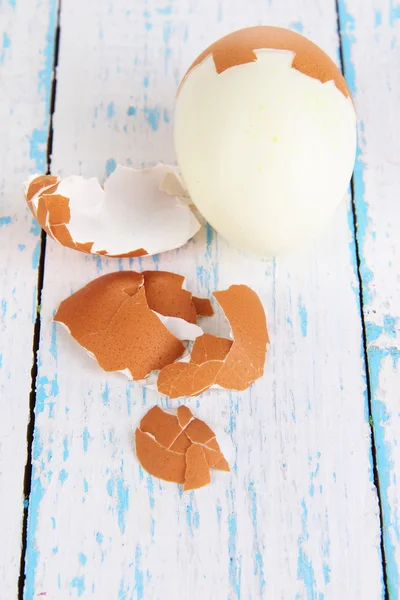 Peeled boiled egg on wooden background — Stock Photo, Image