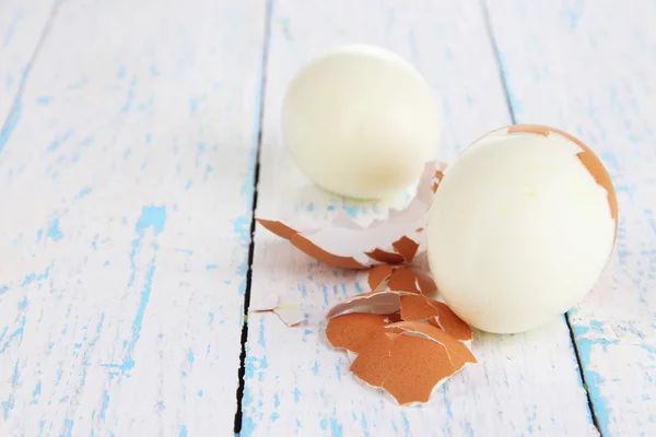 Peeled boiled egg on wooden background — Stock Photo, Image